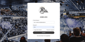 Login-Seite für den THW Kiel vor dem unscharfen Hintergrund einer mit Zuschauern gefüllten Handballhalle. Das Formular fragt nach E-Mail-Adresse und Passwort, mit den Optionen, eingeloggt zu bleiben oder das Passwort wiederherzustellen.